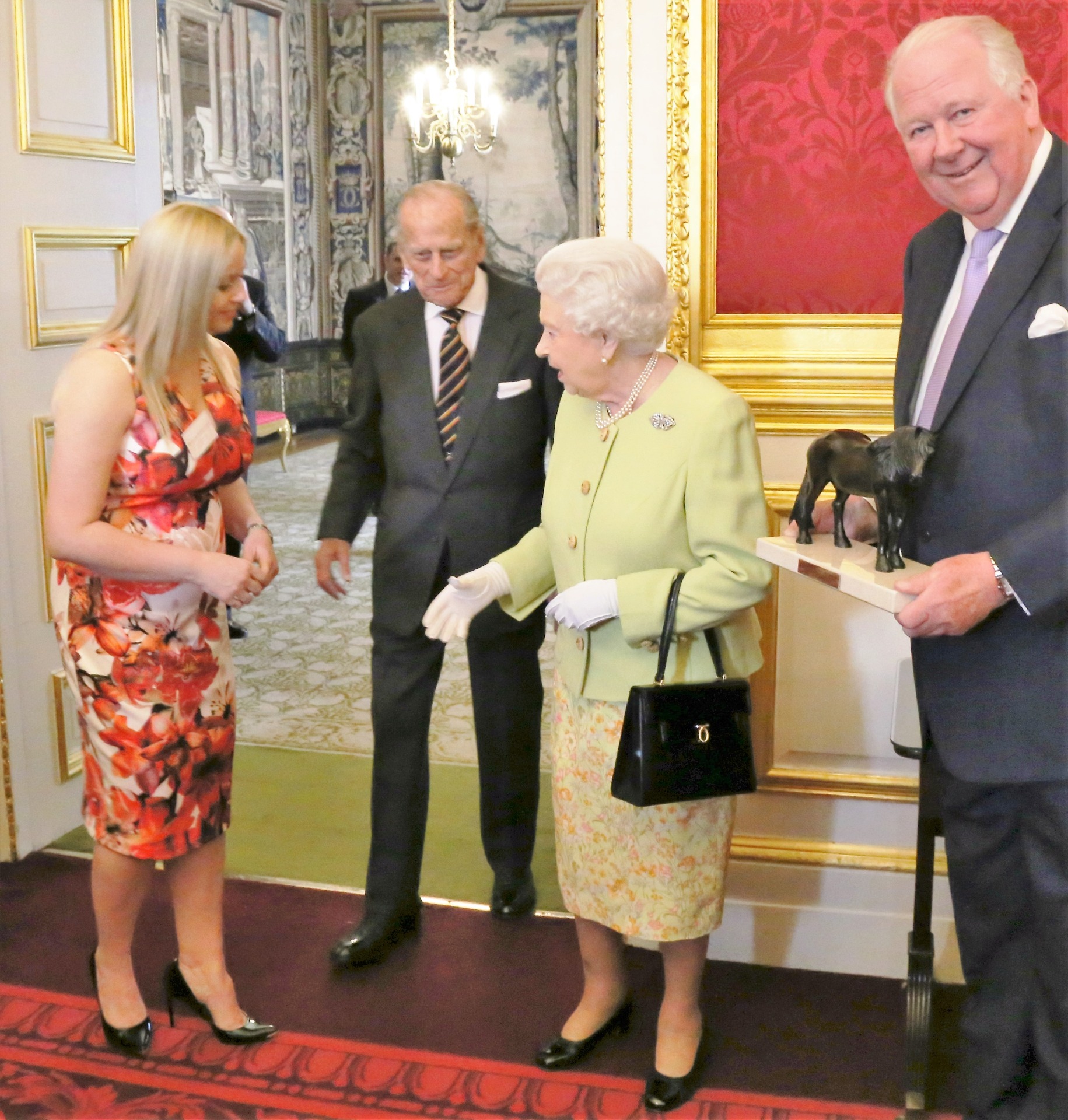 Amanda Hughes-Lubeck with Her Majesty Queen Elizabeth